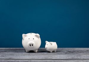 2 piggy banks on a blue background